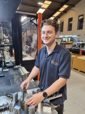 Photo of man working on machinery